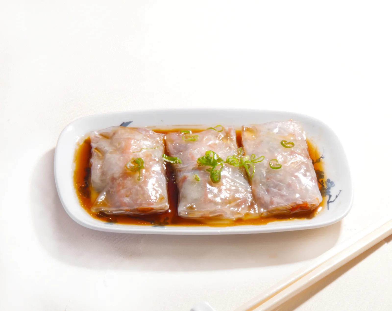 Steamed rice noodle rolls in soy sauce