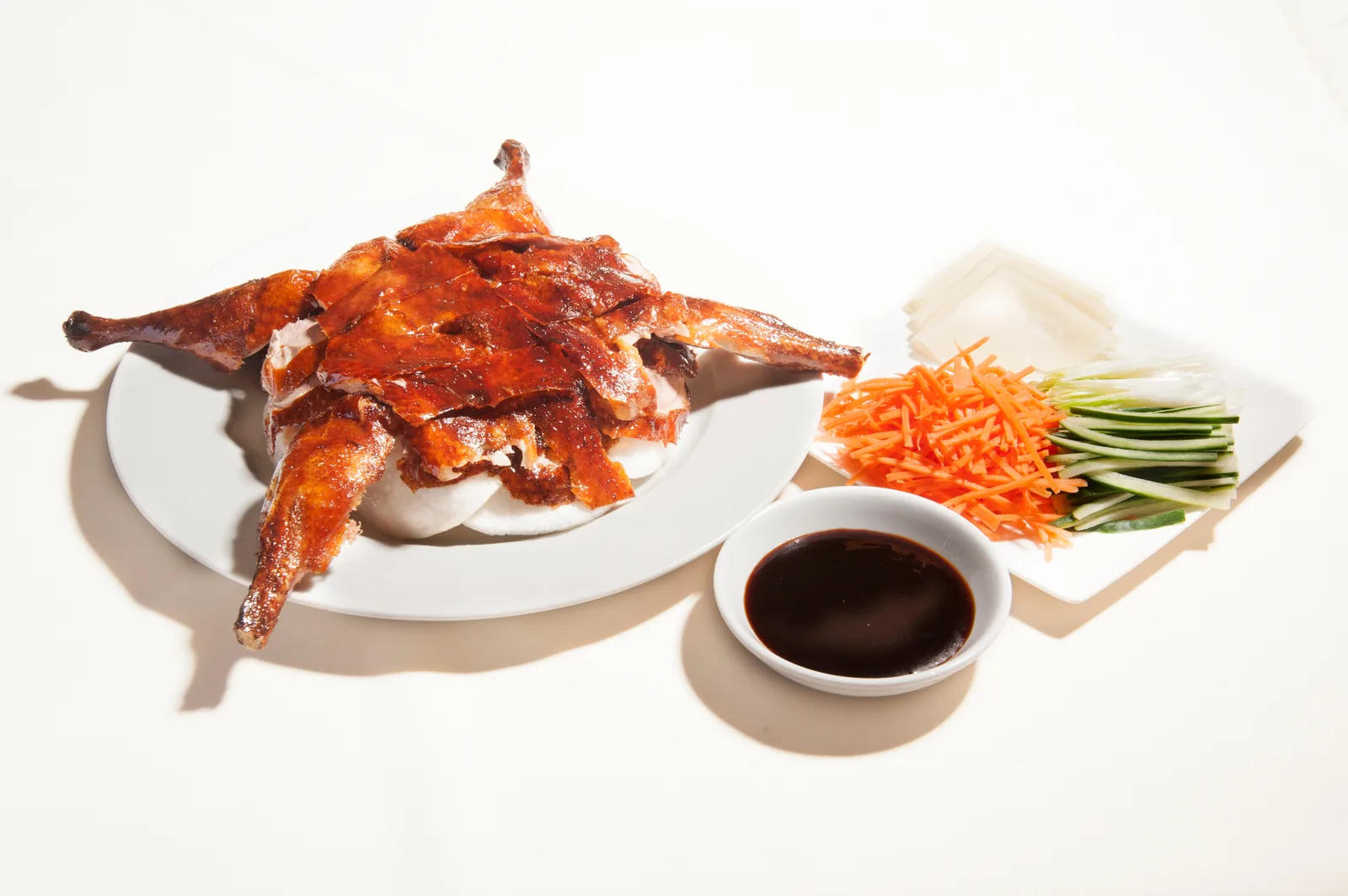 Peking duck with pancakes, vegetables and hoisin sauce